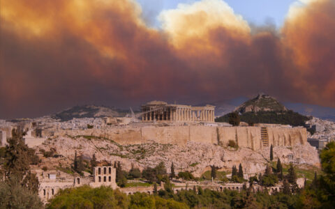 View of the Acropolis and Parthenon against the backdrop of smoke from fires in Athens, Greece